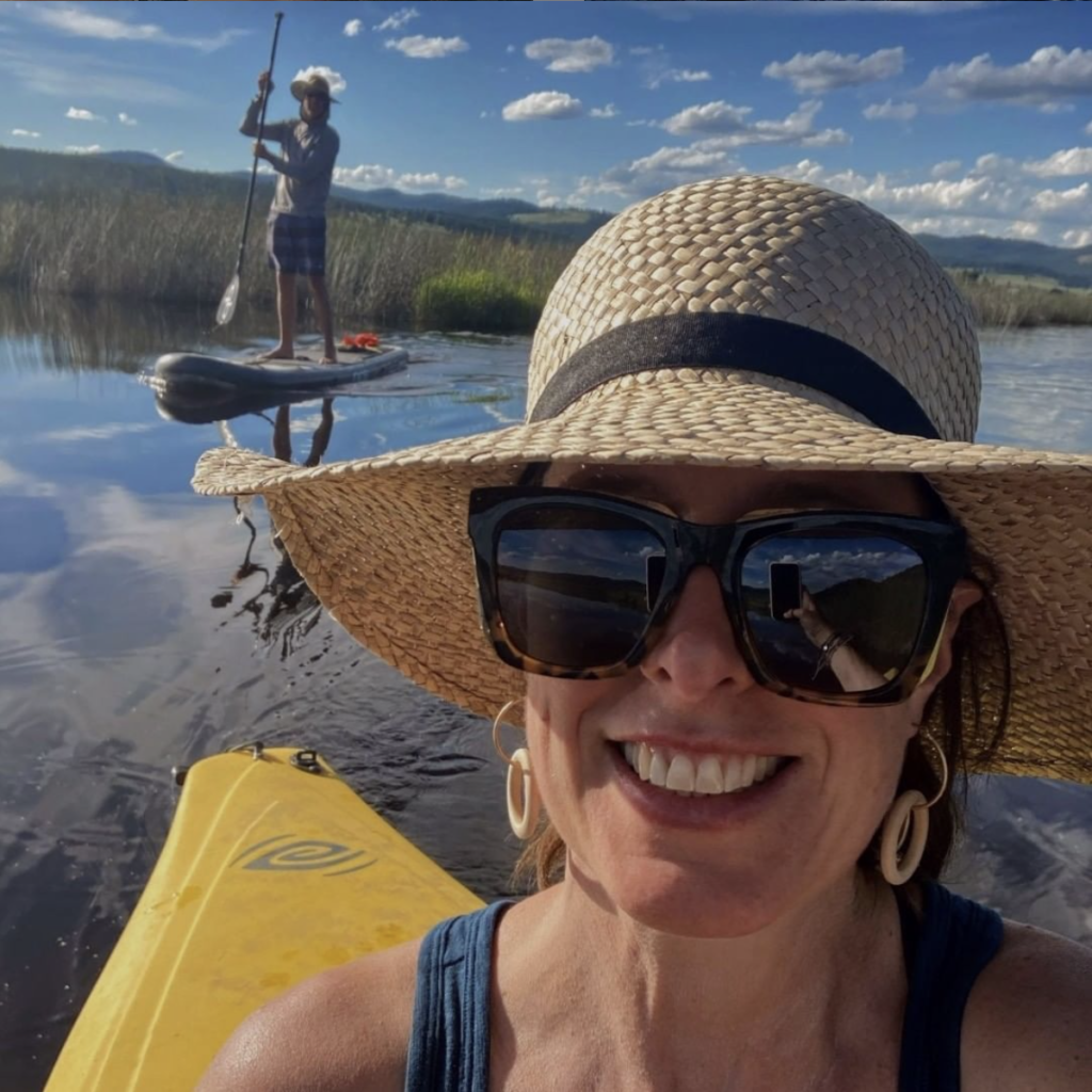 Christine (very happy) kayaking, and Scott (also happy) paddle boarding during a beautiful sunny summer day. 