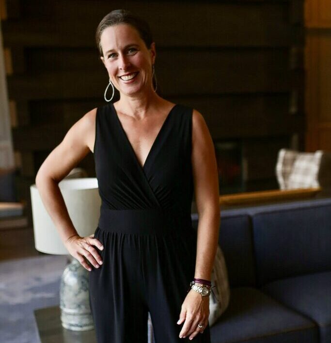 Montana life coach Christine Seager standing with her hand on her hip, posing for a photo and looking happy